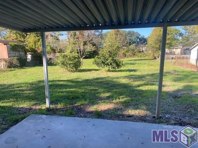 5679 Lemonwood Drive Baton Rouge, LA 70805 - Photo 6 of 6 Large Backyard with cover patio