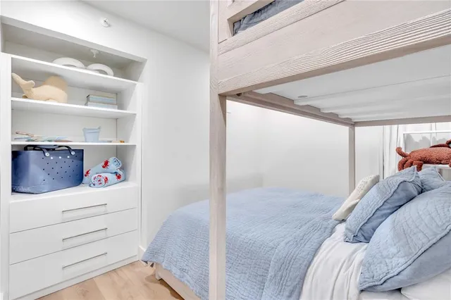 a bed room with a bed and a window