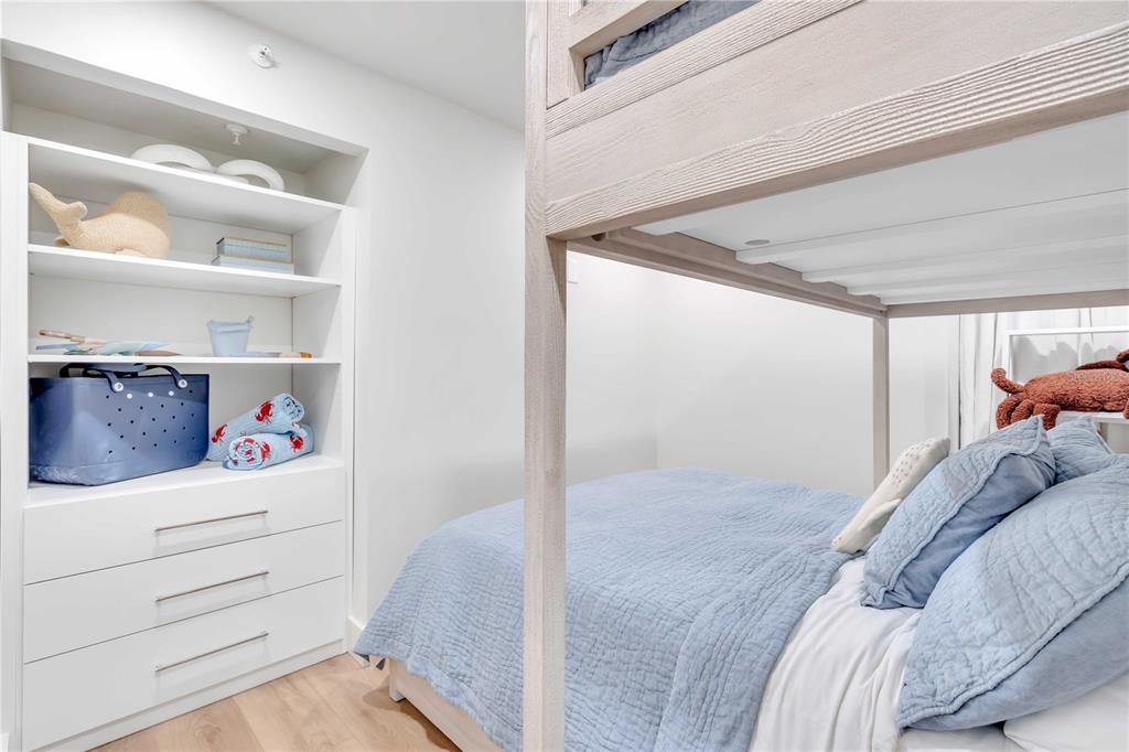 5611 Gulf Of Mexico Drive, Unit 1 Longboat Key, FL 34228 - Photo 14 of 39 a bed room with a bed and a window