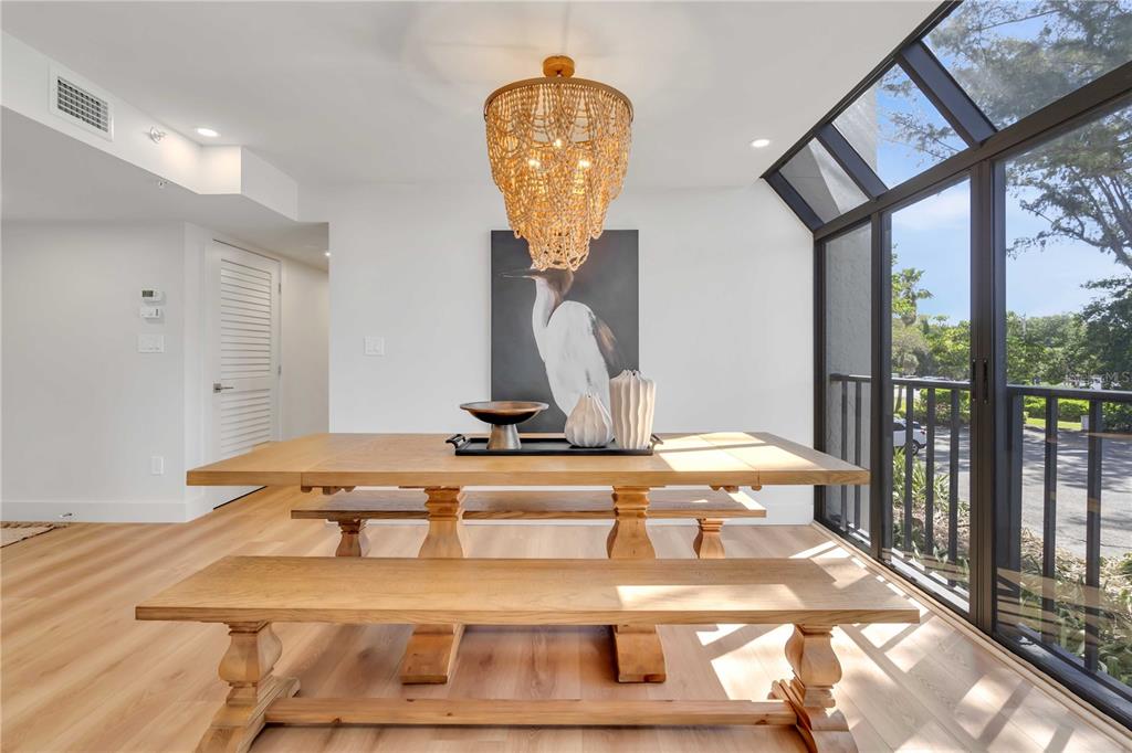 5611 Gulf Of Mexico Drive, Unit 1 Longboat Key, FL 34228 - Photo 15 of 39 a view of a swimming pool with a table & chairs