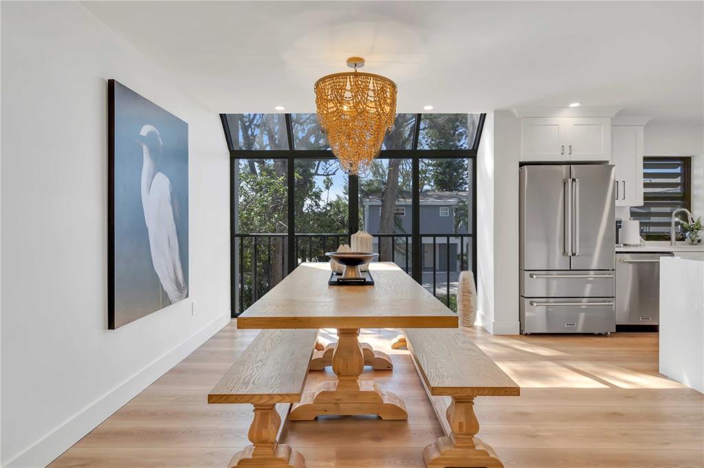 5611 Gulf Of Mexico Drive, Unit 1 Longboat Key, FL 34228 - Photo 16 of 39 a room with pool table and a refrigerator