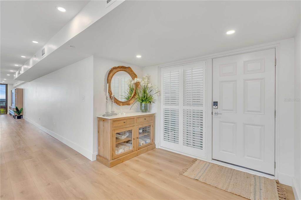 5611 Gulf Of Mexico Drive, Unit 1 Longboat Key, FL 34228 - Photo 2 of 39 a view of room with window and hardwood floor