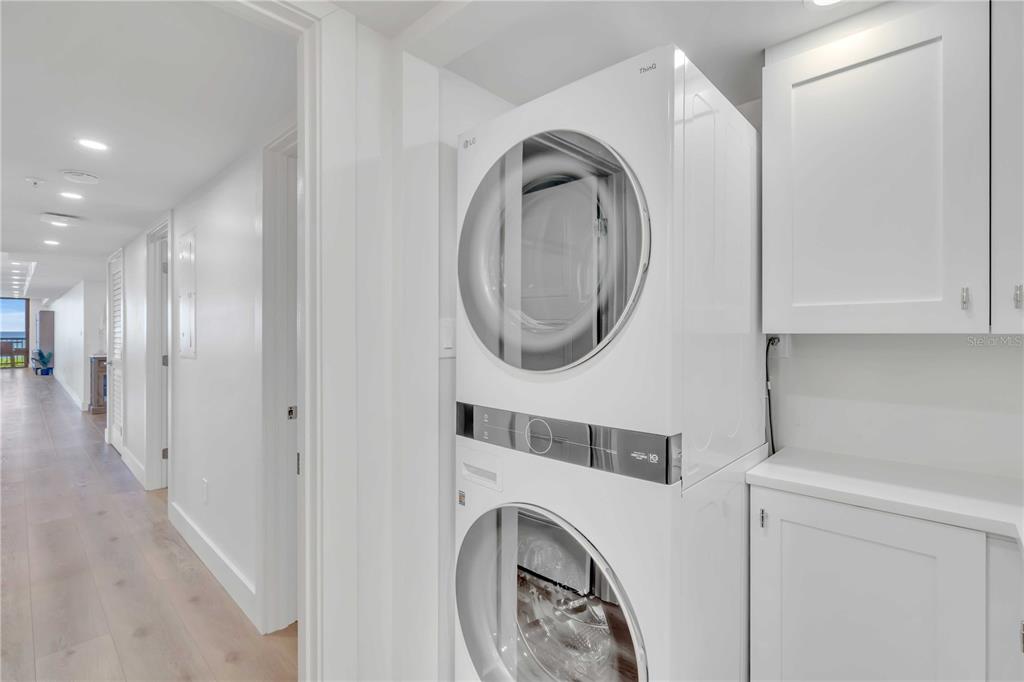 5611 Gulf Of Mexico Drive, Unit 1 Longboat Key, FL 34228 - Photo 25 of 39 a view of a hallway with washer and dryer