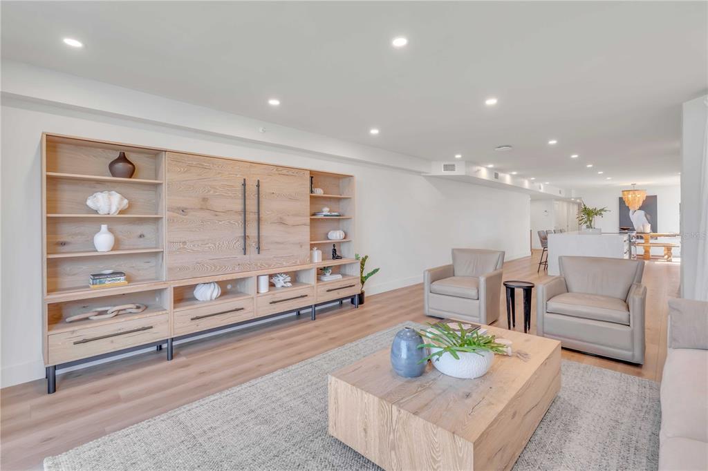 5611 Gulf Of Mexico Drive, Unit 1 Longboat Key, FL 34228 - Photo 3 of 39 a living room with furniture and a table