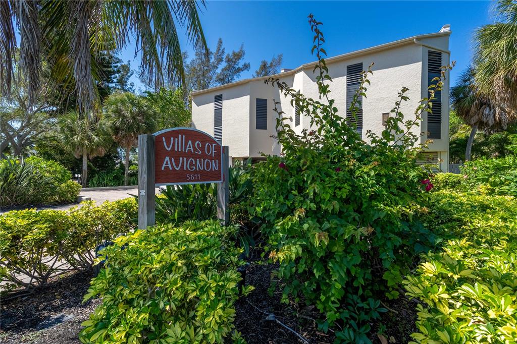5611 Gulf Of Mexico Drive, Unit 1 Longboat Key, FL 34228 - Photo 34 of 39 a view of a back yard of the house