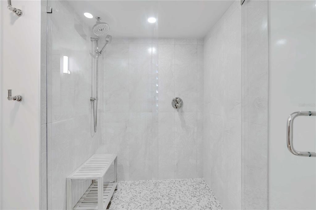 5611 Gulf Of Mexico Drive, Unit 1 Longboat Key, FL 34228 - Photo 8 of 39 a bathroom with a shower