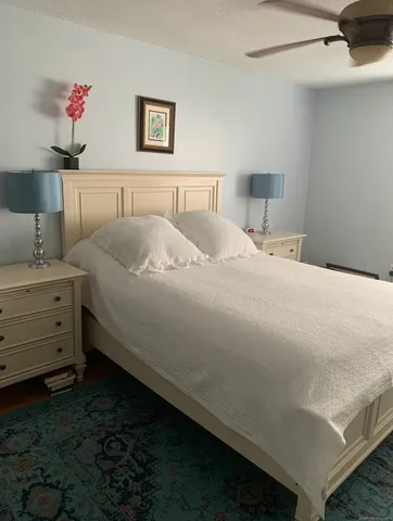 a bedroom with a bed and a cabinets