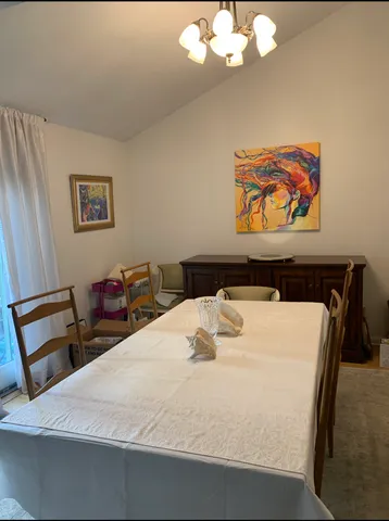 a bedroom with a bed and a desk