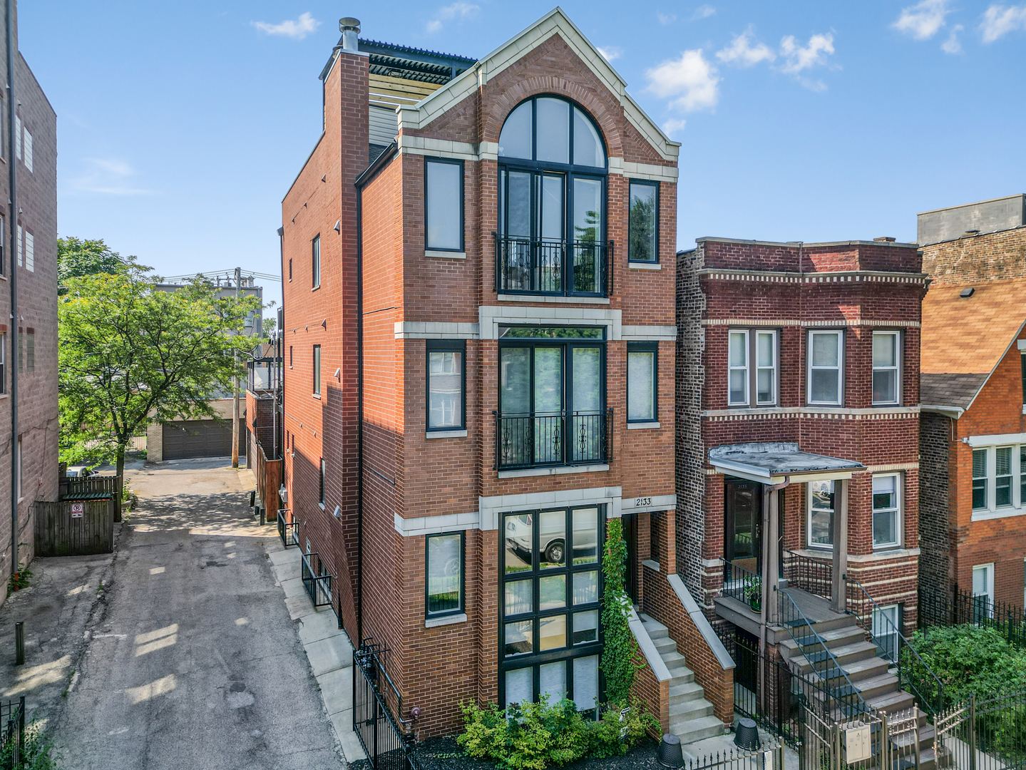 2133 West Rice Street, Unit 3 Chicago, IL 60622 - Photo 1 of 24 a front view of a house with a yard