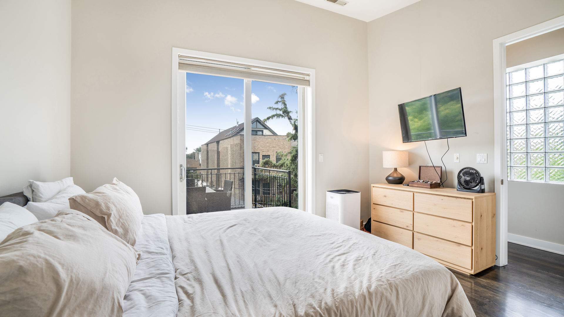 2133 West Rice Street, Unit 3 Chicago, IL 60622 - Photo 18 of 24 a bedroom with a bed and a window
