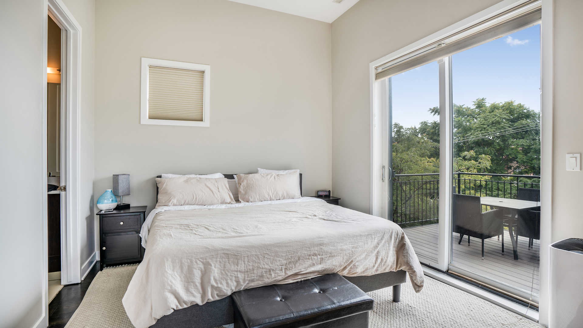2133 West Rice Street, Unit 3 Chicago, IL 60622 - Photo 19 of 24 a bedroom with a bed and a large window