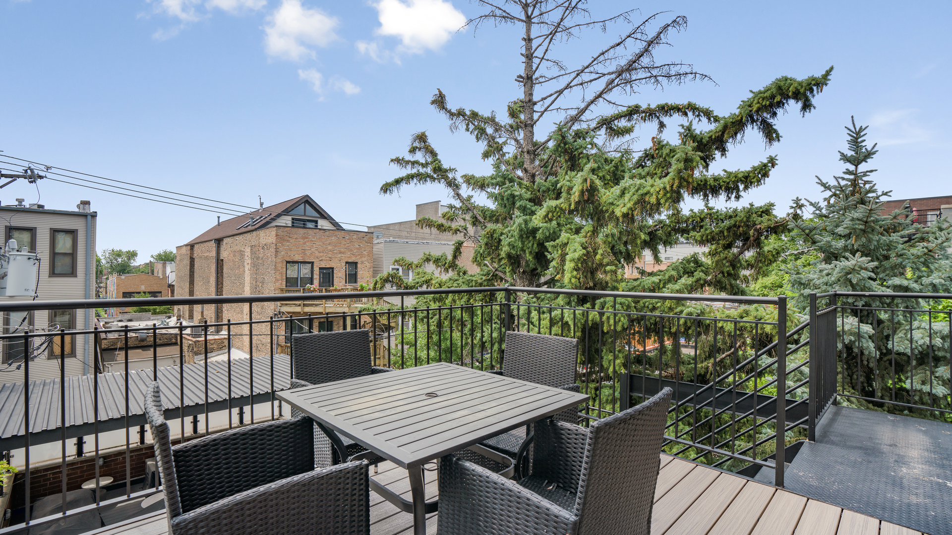 2133 West Rice Street, Unit 3 Chicago, IL 60622 - Photo 21 of 24 a view of a balcony with wooden floor and outdoor seating