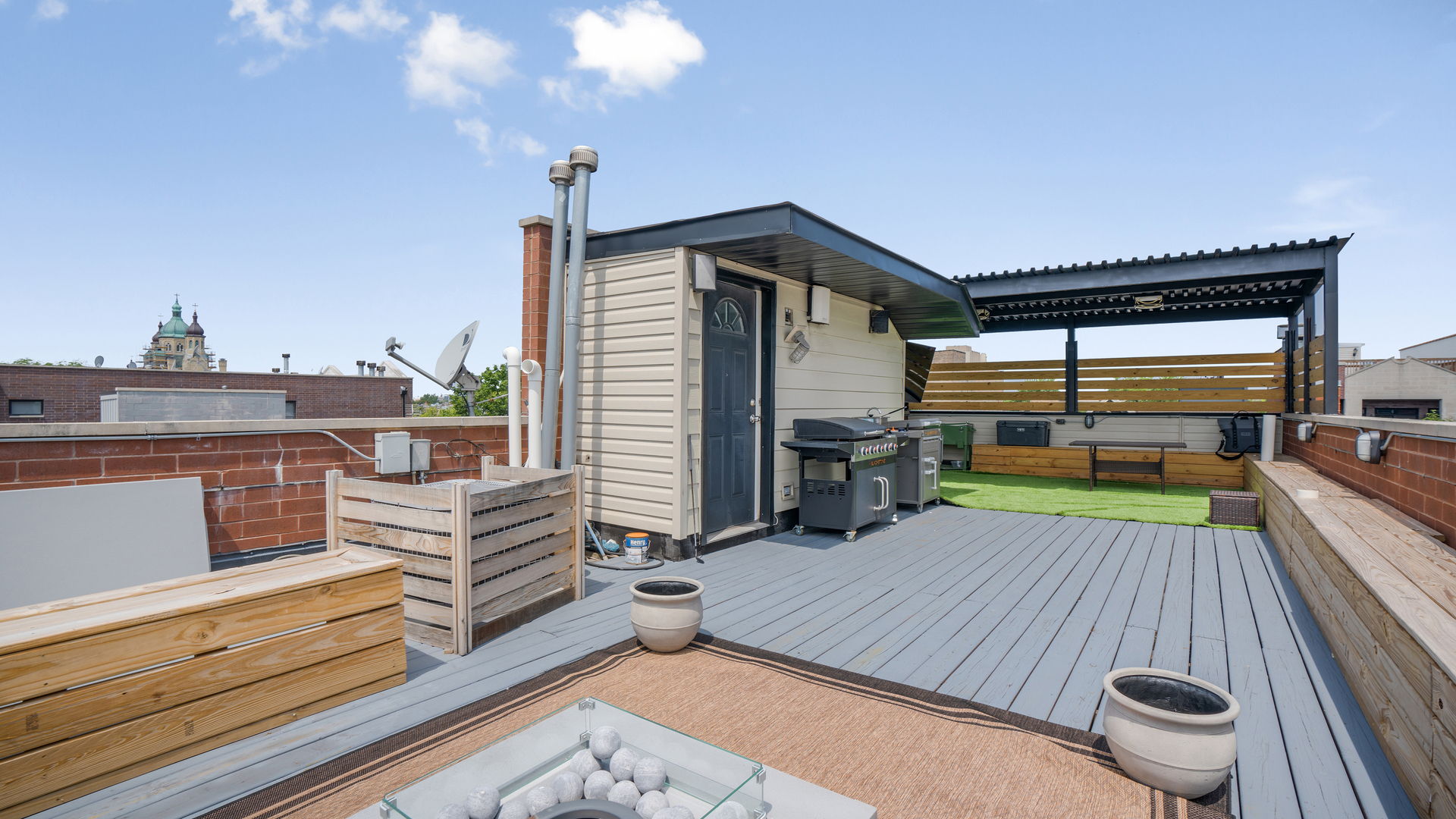 2133 West Rice Street, Unit 3 Chicago, IL 60622 - Photo 23 of 24 a view of a balcony with chair and wooden floor