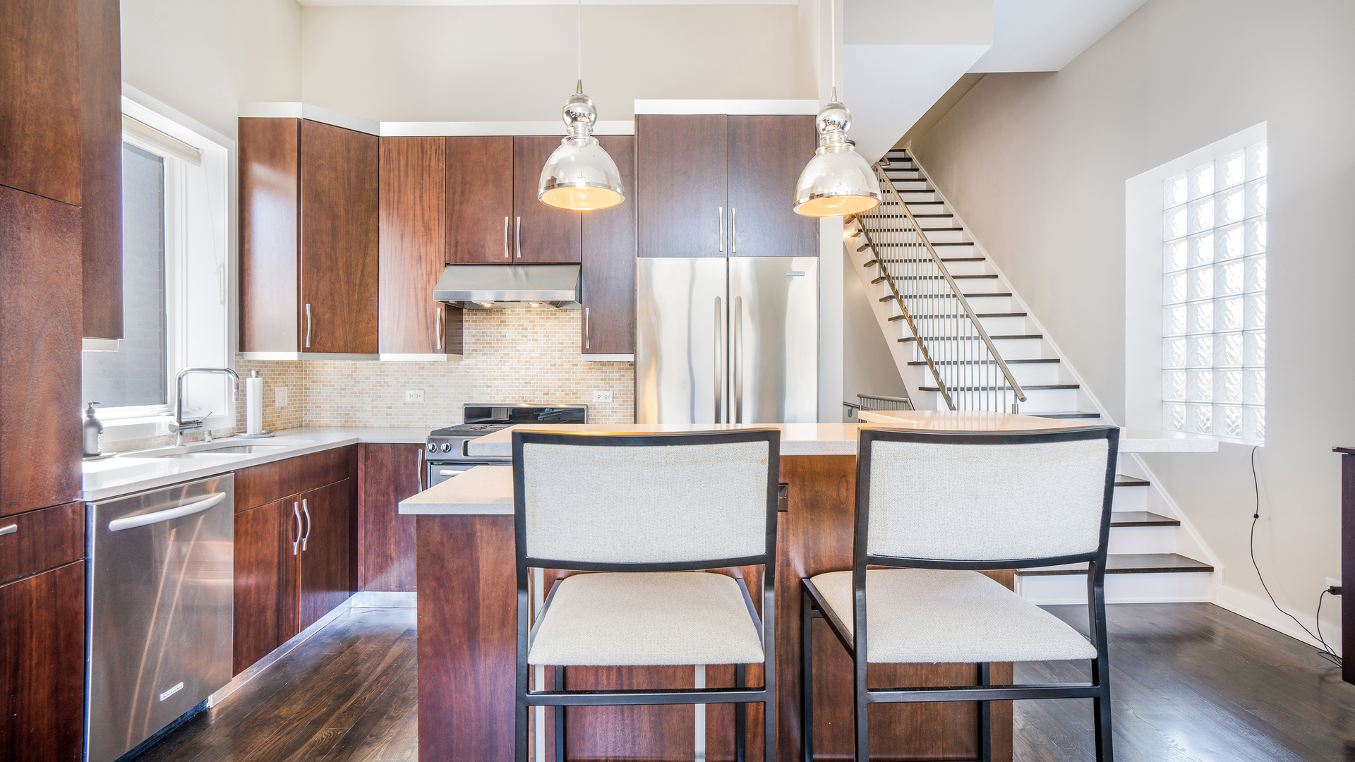 2133 West Rice Street, Unit 3 Chicago, IL 60622 - Photo 9 of 24 a view of kitchen with furniture and wooden floor