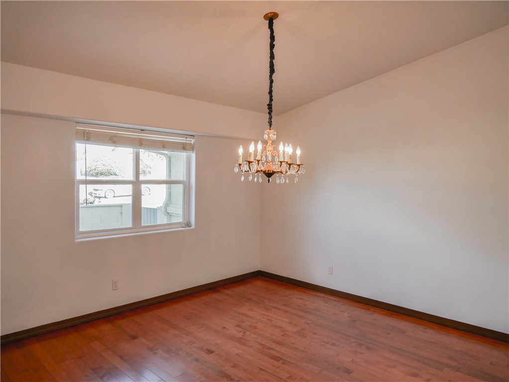 2575 Triangle S Street Kingman, AZ 86401 - Photo 8 of 45 a view of a room with wooden floor chandelier and window