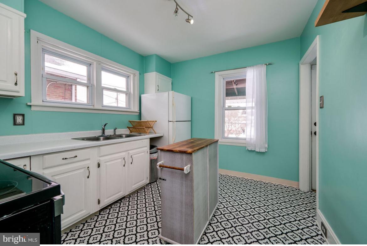 2054 Cleveland Avenue Reading, PA 19609 - Photo 12 of 27 a kitchen with a refrigerator and a sink