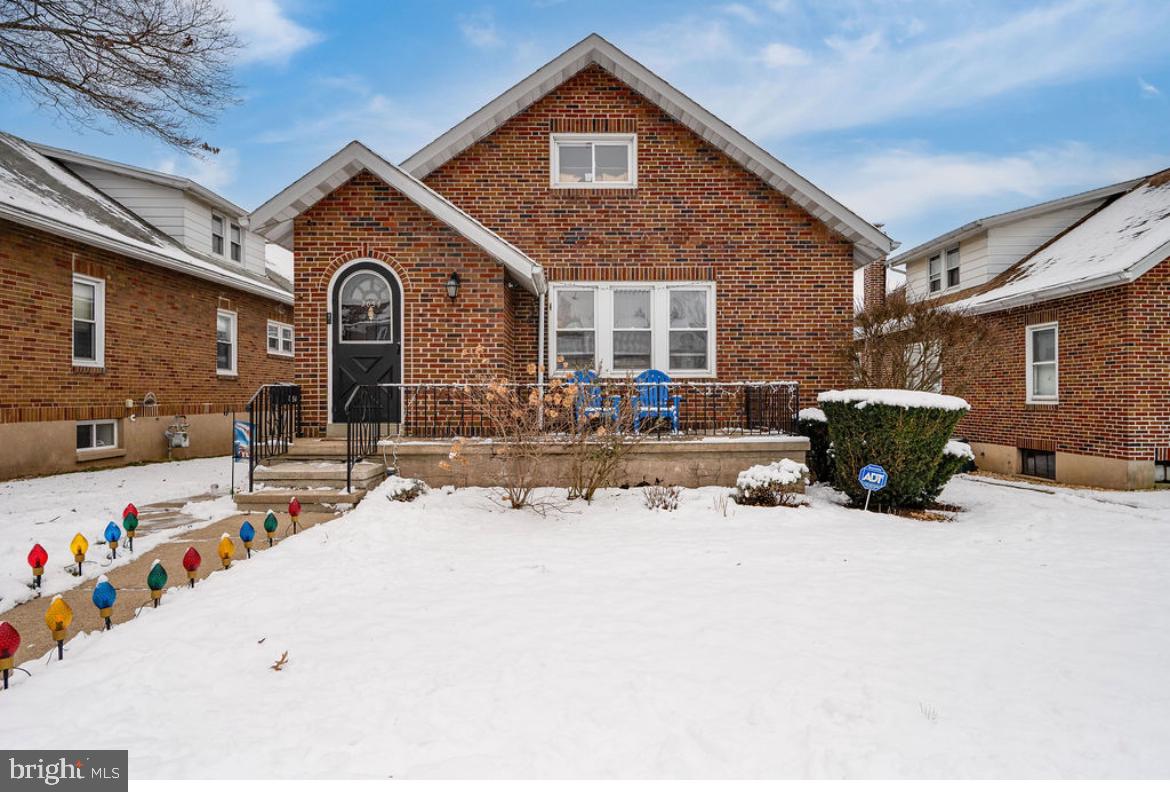 2054 Cleveland Avenue Reading, PA 19609 - Photo 2 of 27 a front view of a house with cars