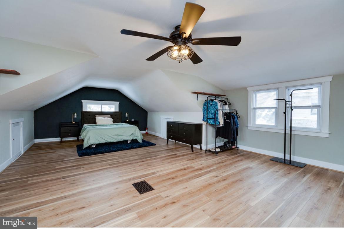 2054 Cleveland Avenue Reading, PA 19609 - Photo 22 of 27 a bedroom with a bed and a chandelier