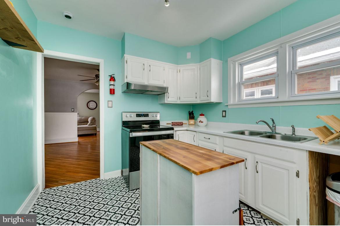 2054 Cleveland Avenue Reading, PA 19609 - Photo 10 of 27 a kitchen with stainless steel appliances granite countertop a sink stove and refrigerator