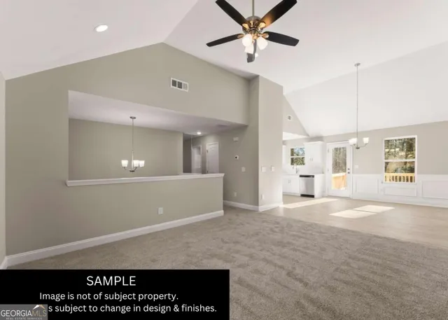 a view of a livingroom with a ceiling fan and window