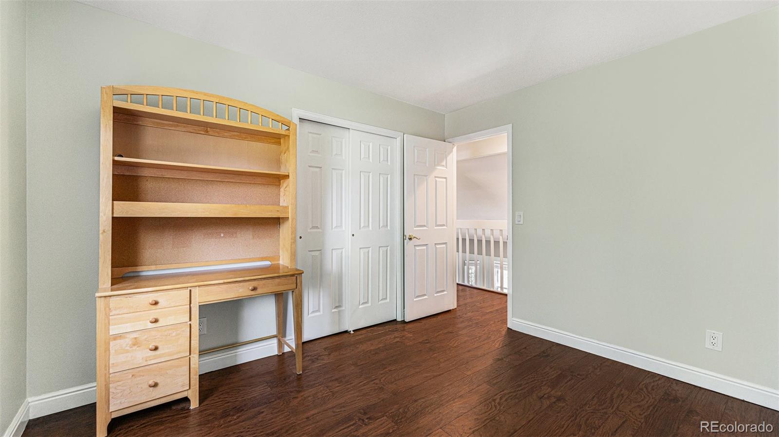 9897 Independence Street Westminster, CO 80021 - Photo 16 of 29 a room with cabinet and wooden floor