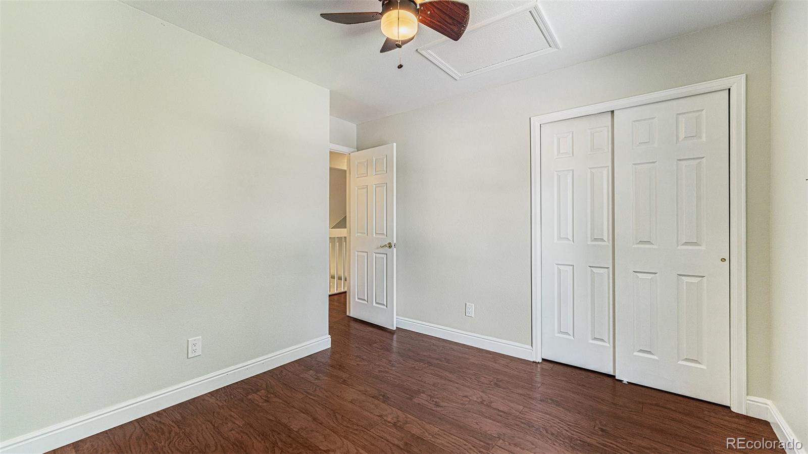 9897 Independence Street Westminster, CO 80021 - Photo 18 of 29 wooden floor in an empty room