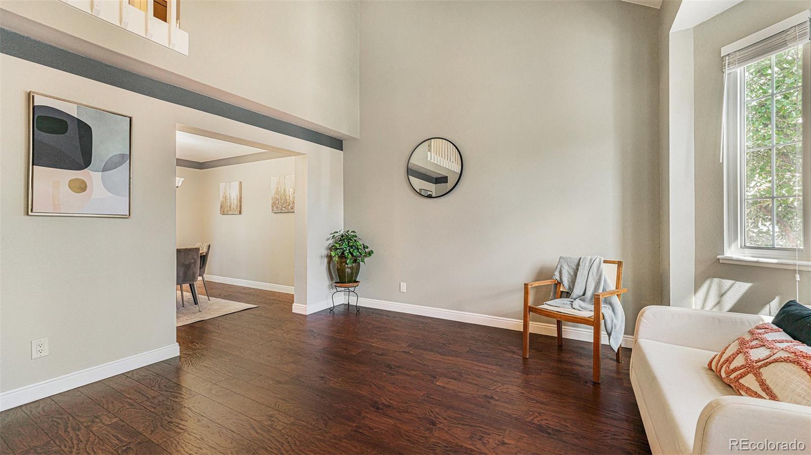 9897 Independence Street Westminster, CO 80021 - Photo 4 of 29 a living room with furniture and wooden floor