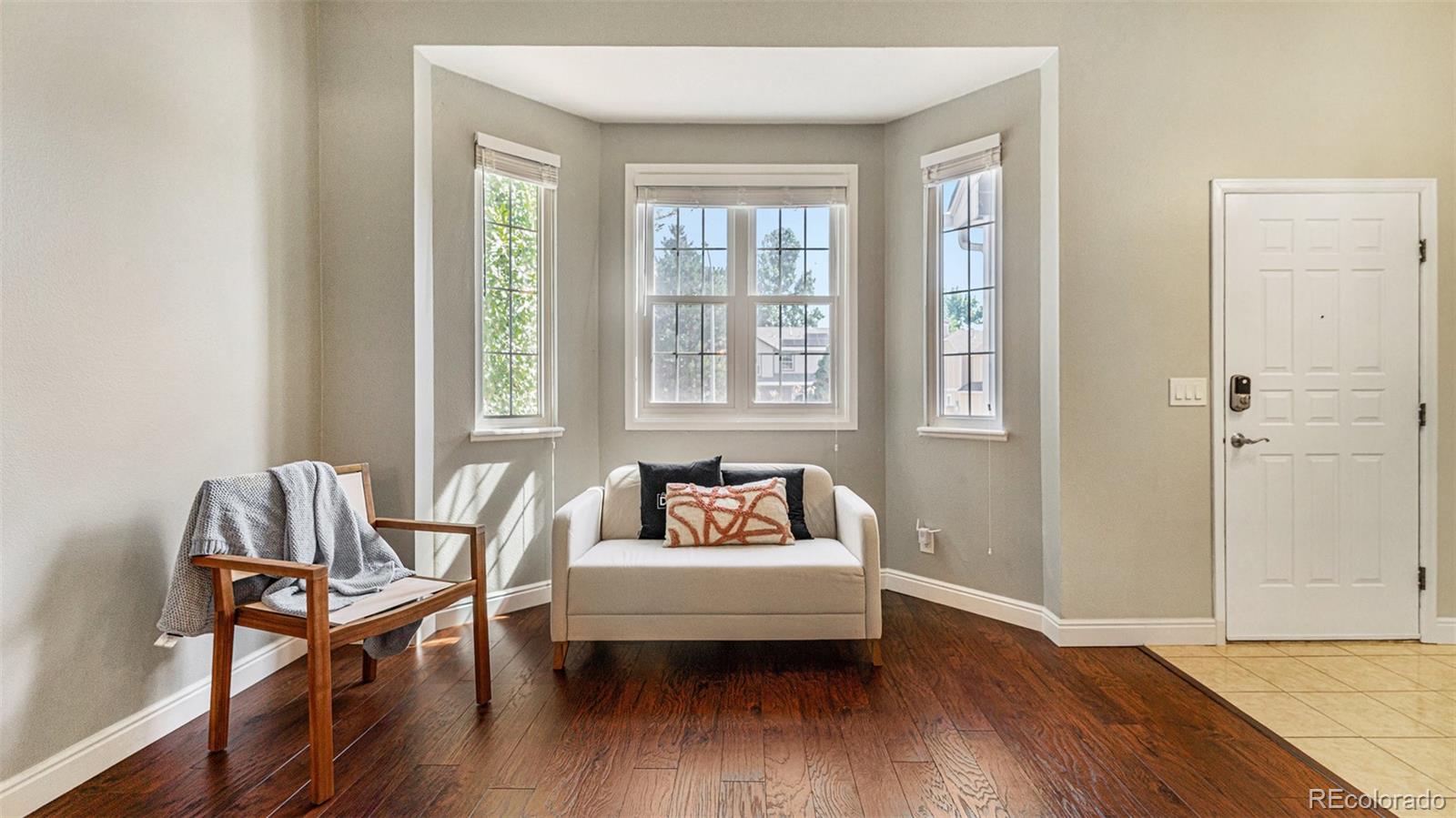 9897 Independence Street Westminster, CO 80021 - Photo 5 of 29 a living room with furniture and a wooden floor