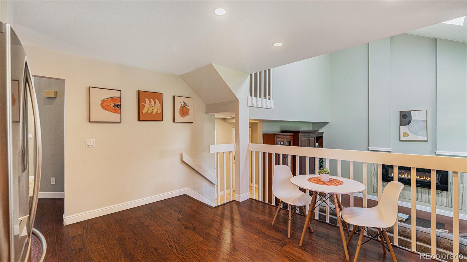 9897 Independence Street Westminster, CO 80021 - Photo 8 of 29 a view of a dining room with furniture window and wooden floor
