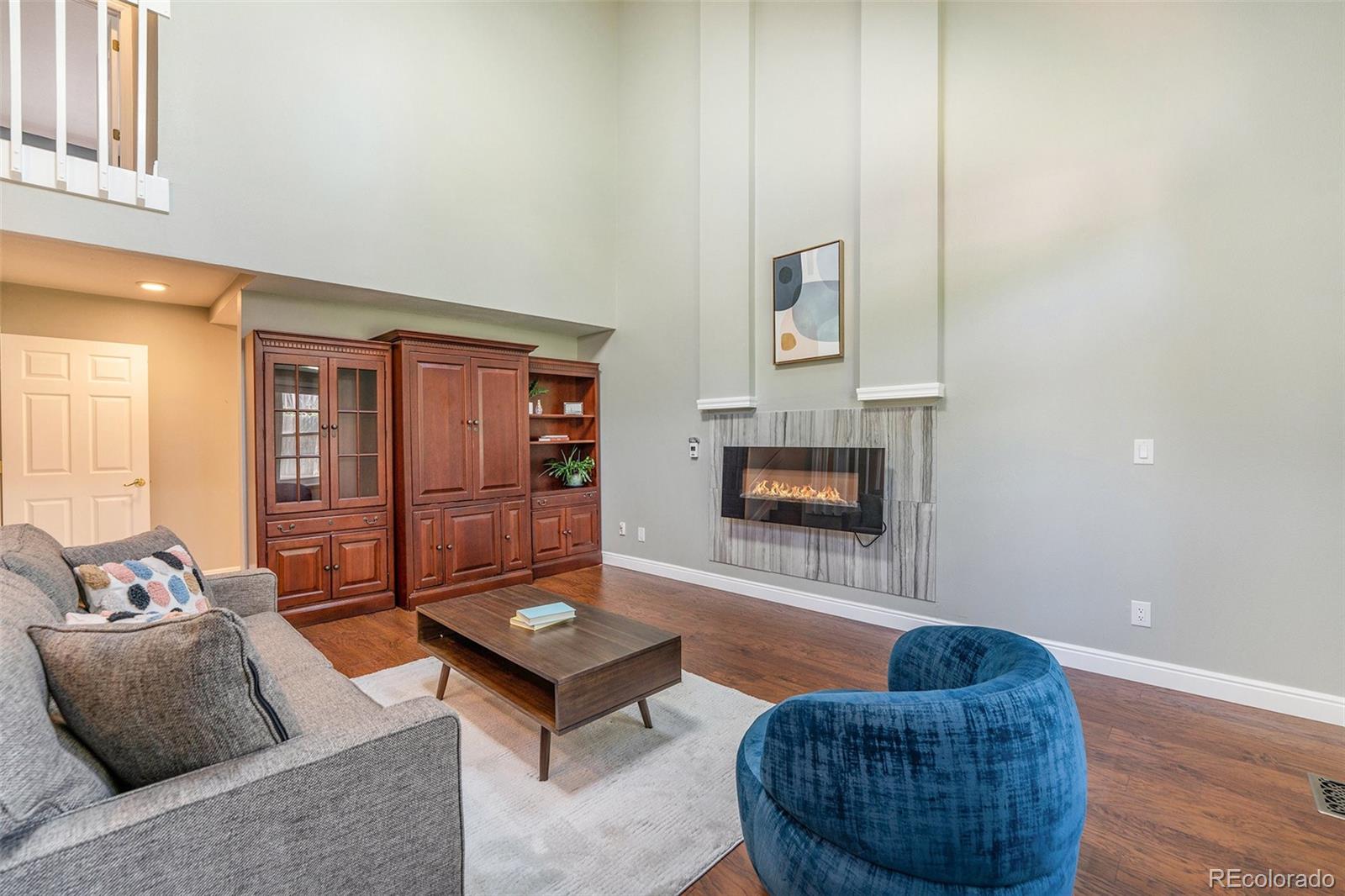 9897 Independence Street Westminster, CO 80021 - Photo 9 of 29 a living room with furniture rug and window