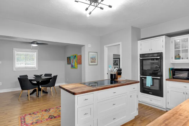 a living room with granite countertop furniture and fireplace