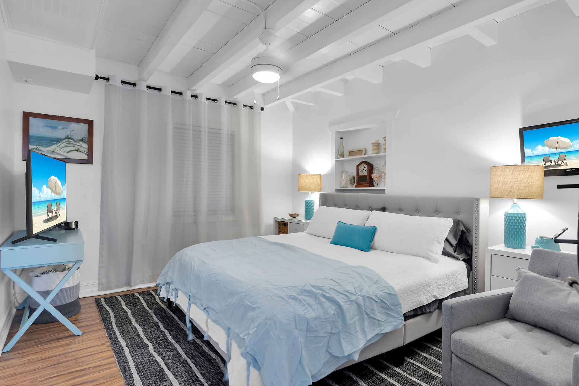 230 Key Honey Road Tavernier, FL 33070 - Photo 22 of 38 a bedroom with a bed and a wooden floor