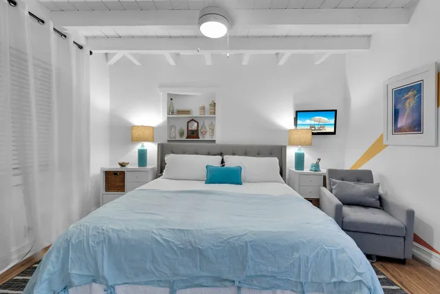 a bedroom with a bed and a couch