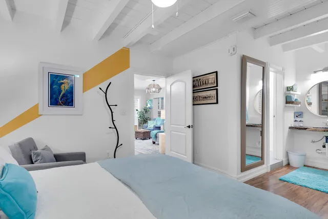 a bedroom with furniture and a gallery