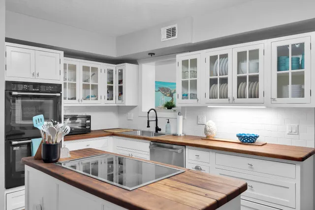 a kitchen with a sink and cabinets