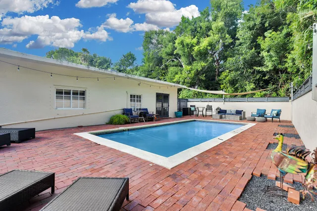 a view of a house with swimming pool