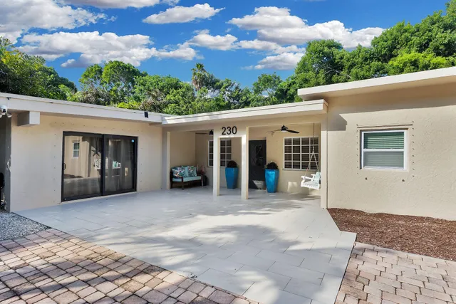 a house with trees in the background