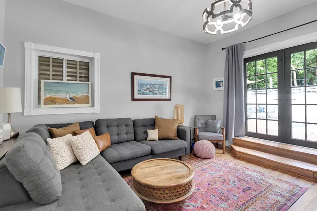 a living room with furniture and a rug