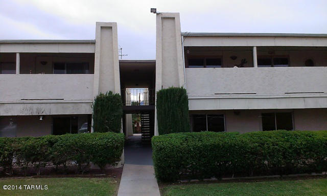 625 South Prudence Road, Unit 108 Tucson, AZ 85710 - Photo 1 of 20 a front view of a house with a yard