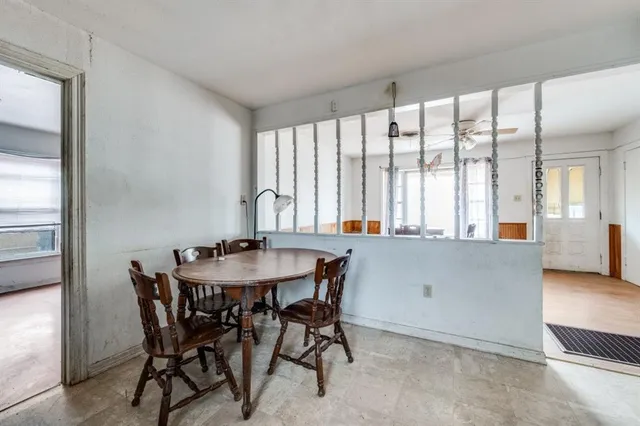 a kitchen that has a sink and a stove in it