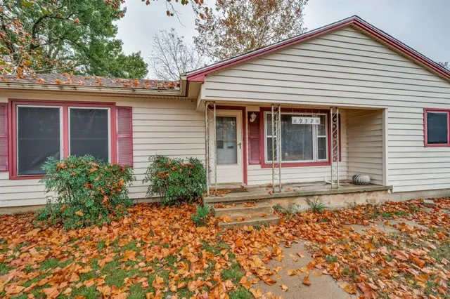 a view of a house with a small garden
