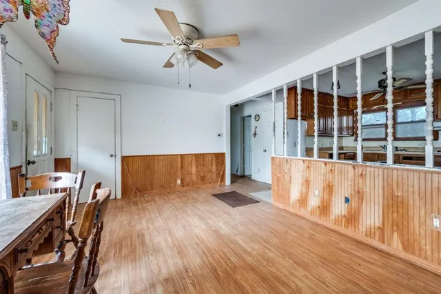 a view of room with furniture and wooden floor