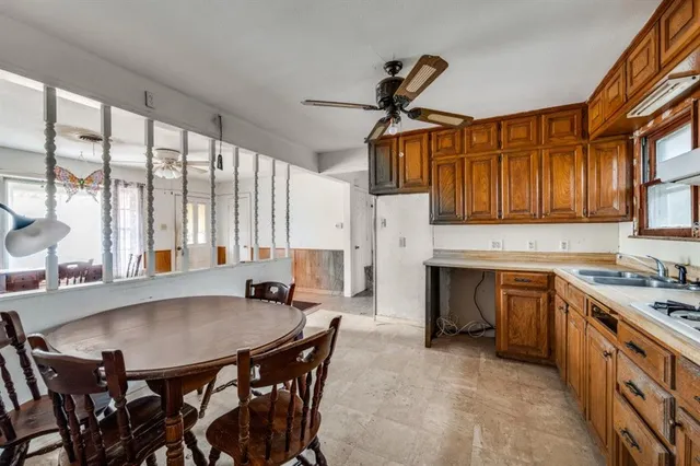 a view of a dining room with furniture and a large window