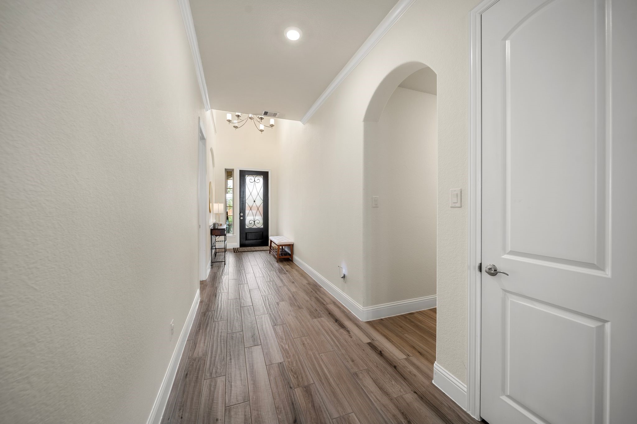 18307 Whistling Hills Road Cypress, TX 77433 - Photo 12 of 38 Back at the entrance of the home, you have access on the right to your Next Gen suite. And to the left, the hallway leads to your utility room and 3rd bedroom and full bath.