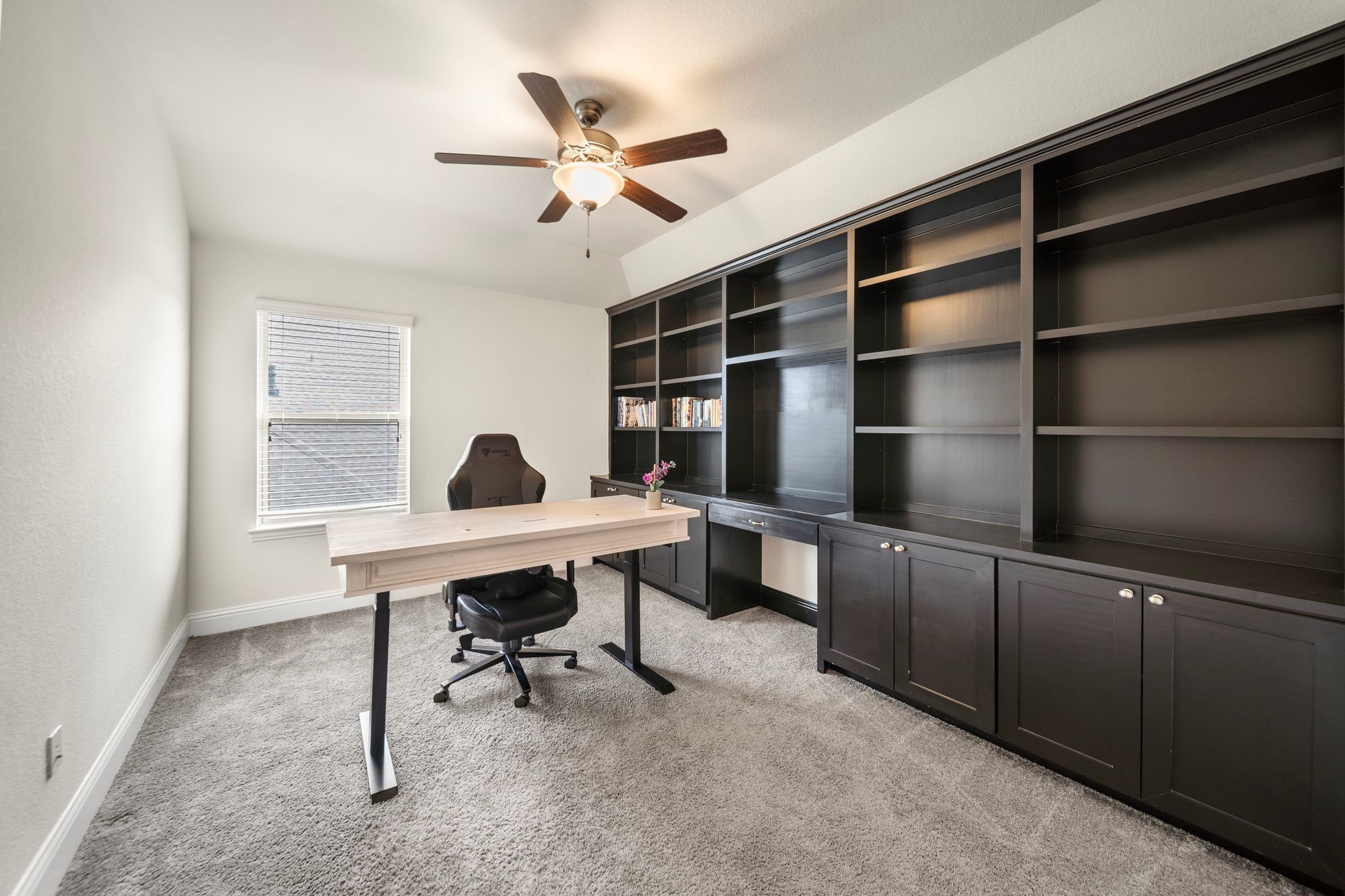 18307 Whistling Hills Road Cypress, TX 77433 - Photo 29 of 38 The third upstairs bedroom features beautiful built-ins and offers great flexibility. Currently used as an office, it has a full bath just outside and easily functions as a bedroom.