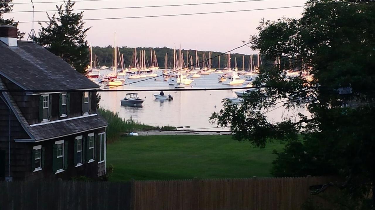 56 Elgin Road Pocasset, MA 02559 - Photo 1 of 35 a view of swimming pool yard and outdoor seating
