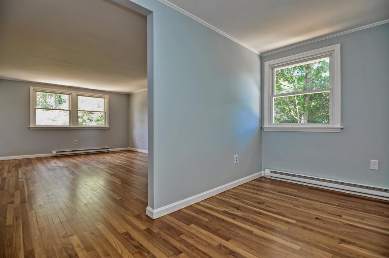 56 Elgin Road Pocasset, MA 02559 - Photo 15 of 35 a view of empty room with wooden floor and fan