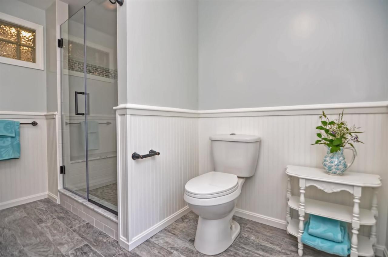 56 Elgin Road Pocasset, MA 02559 - Photo 17 of 35 a bathroom with a toilet and a shower