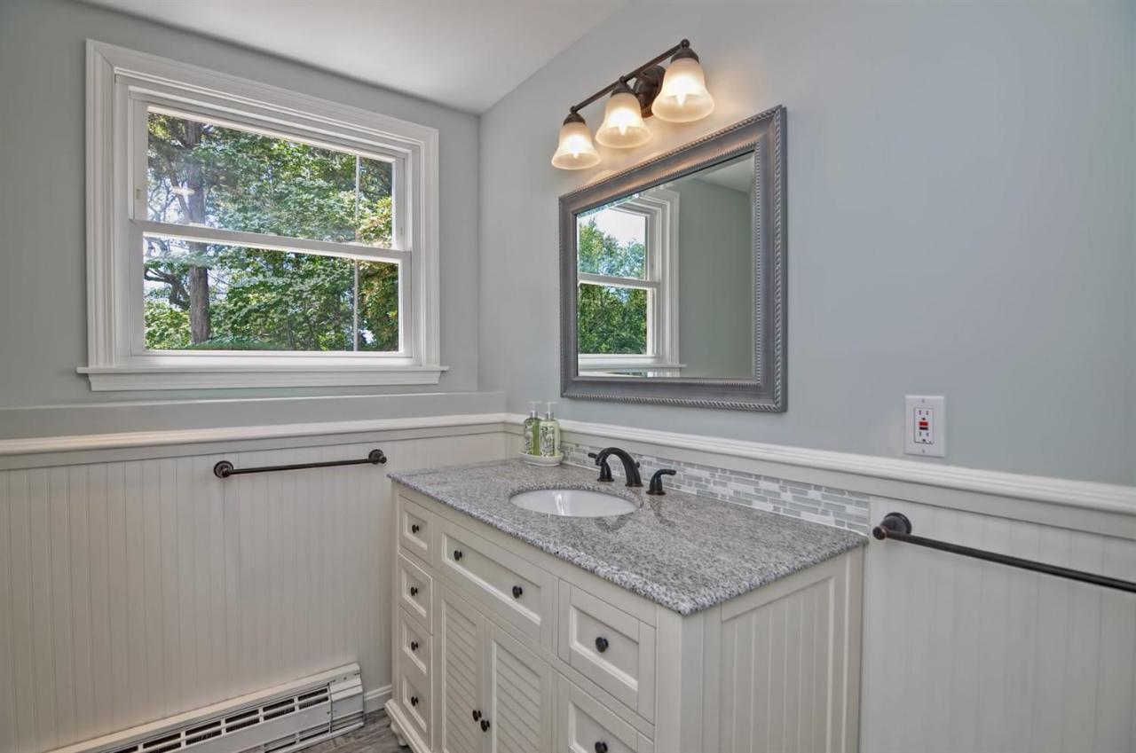 56 Elgin Road Pocasset, MA 02559 - Photo 26 of 35 a bathroom with a sink and a window