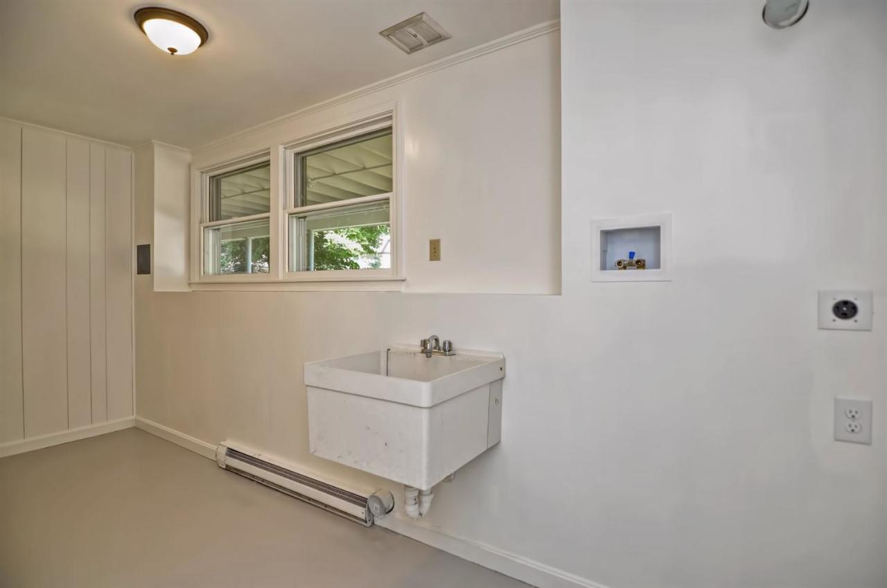 56 Elgin Road Pocasset, MA 02559 - Photo 29 of 35 a bathroom with a sink a window and a mirror